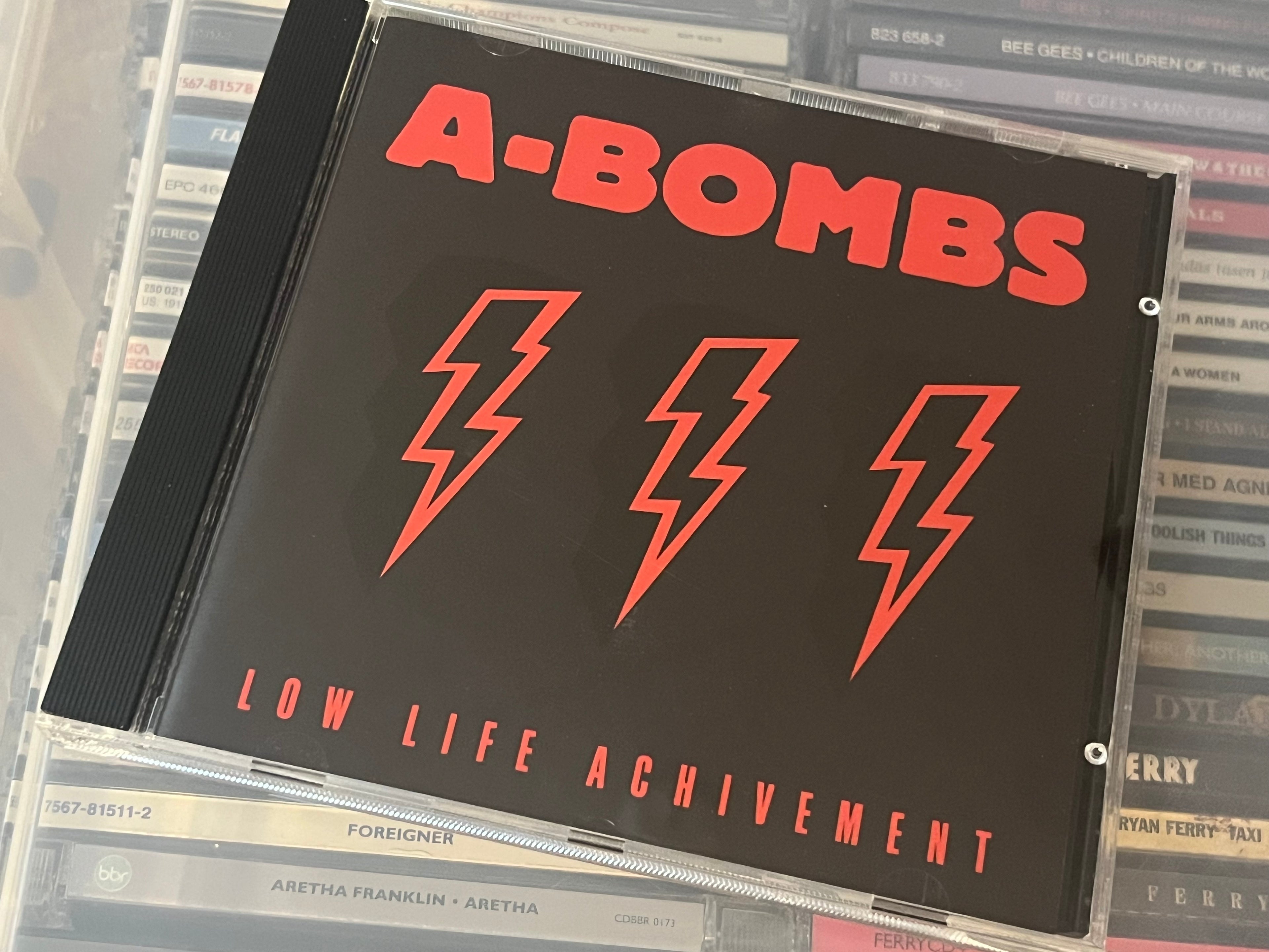 A-Bombs ‎– Low Life Achivement (NM/NM)