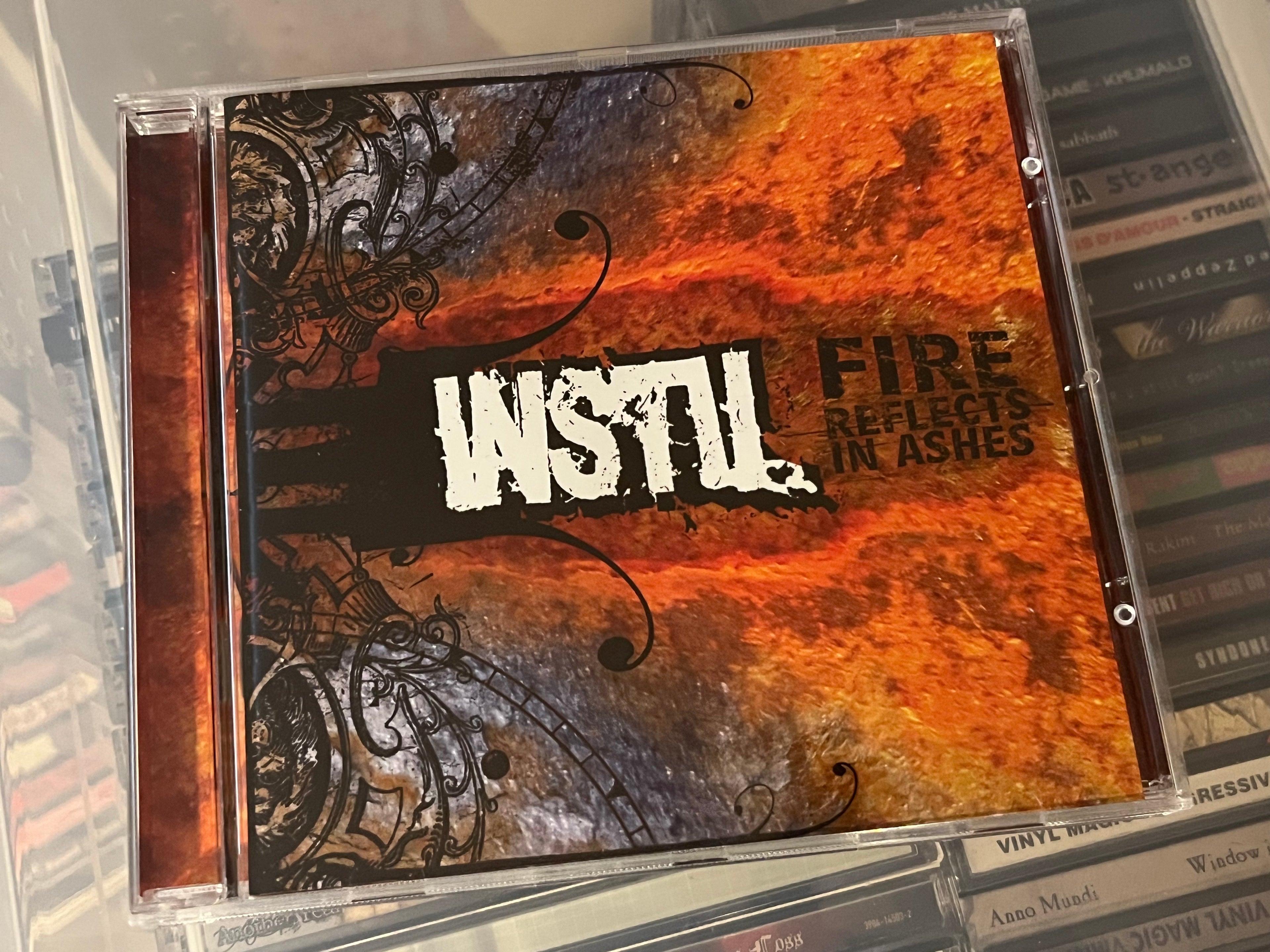 Instil – Fire Reflects In Ashes (NM/NM)