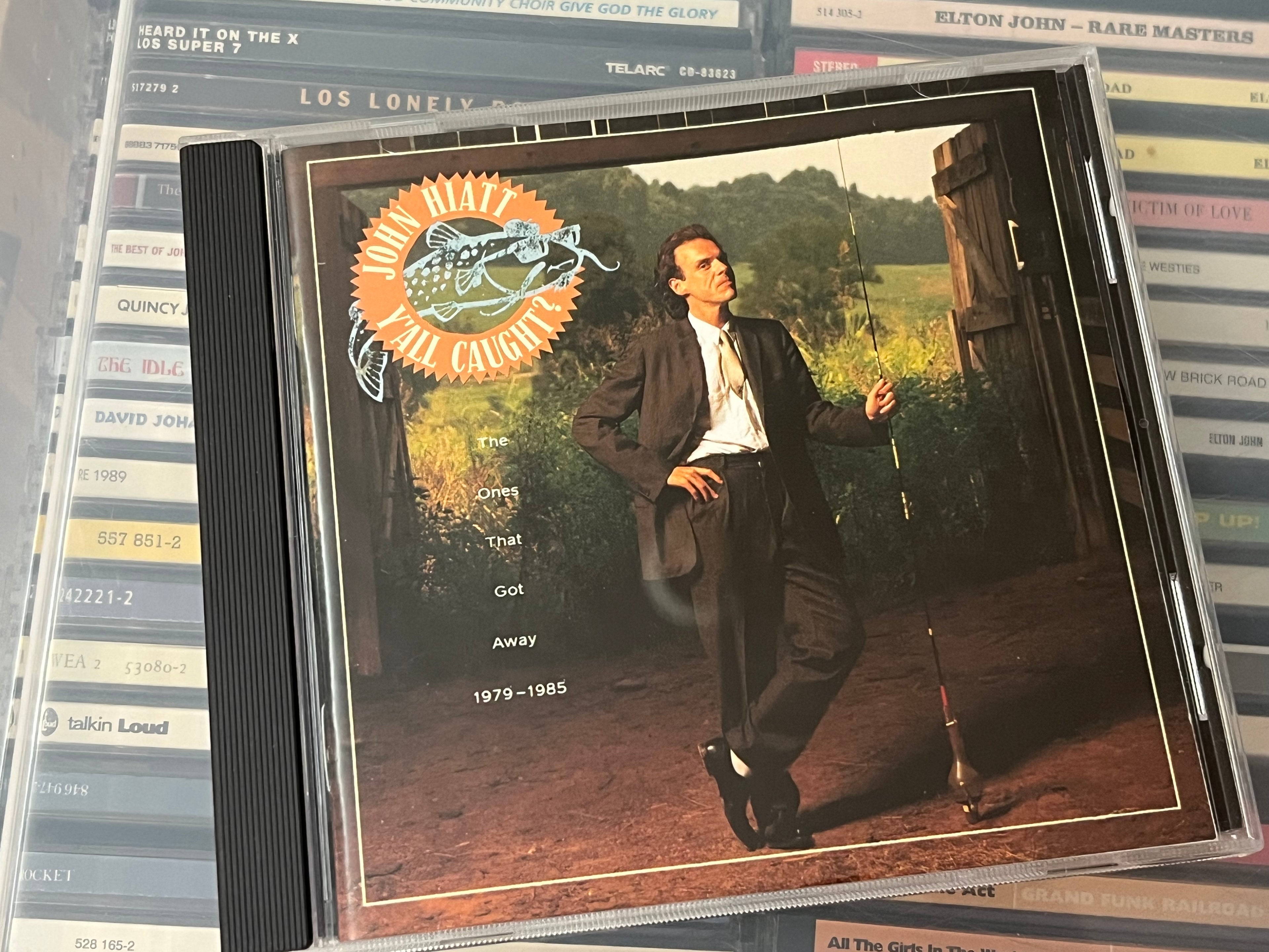 John Hiatt ‎– Y'All Caught? - The Ones That Got Away 1979-1985 (NM/NM)