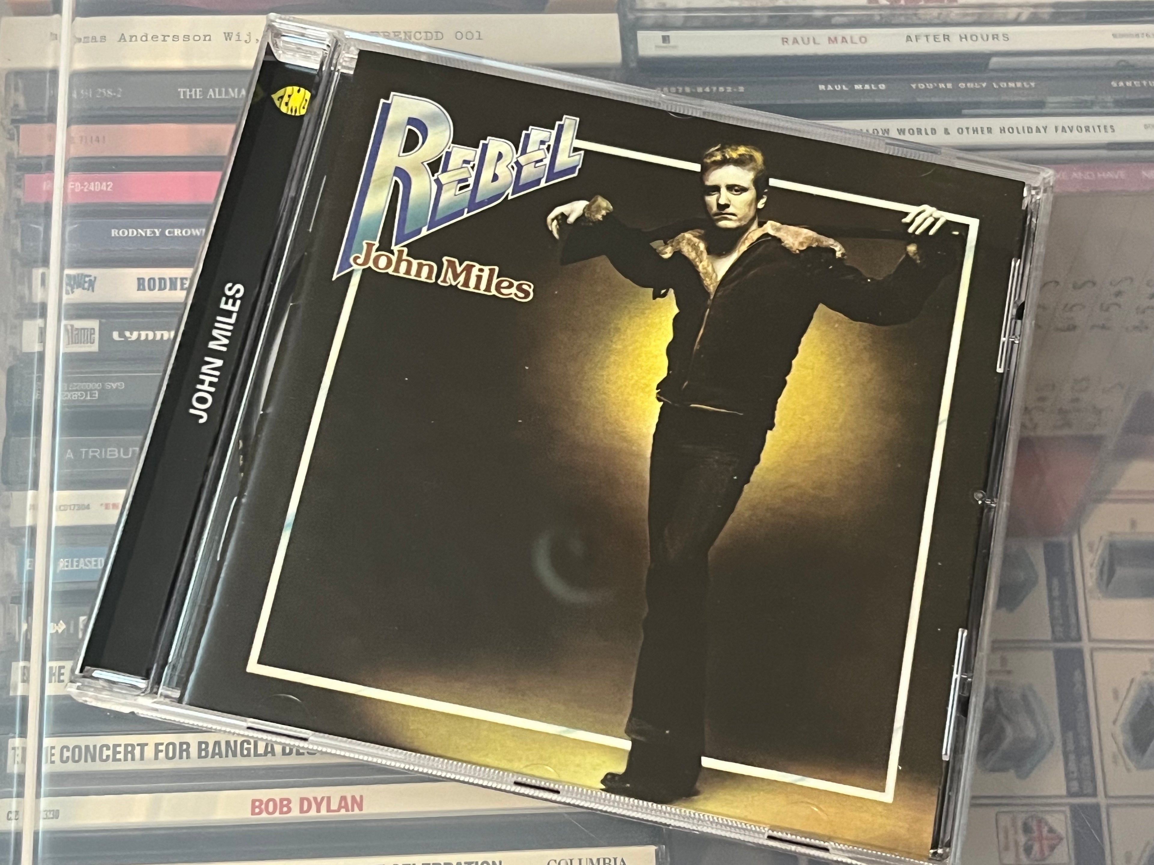 John Miles – Rebel (NM/NM) Russia-2008 Remaster +2 bonusspår!