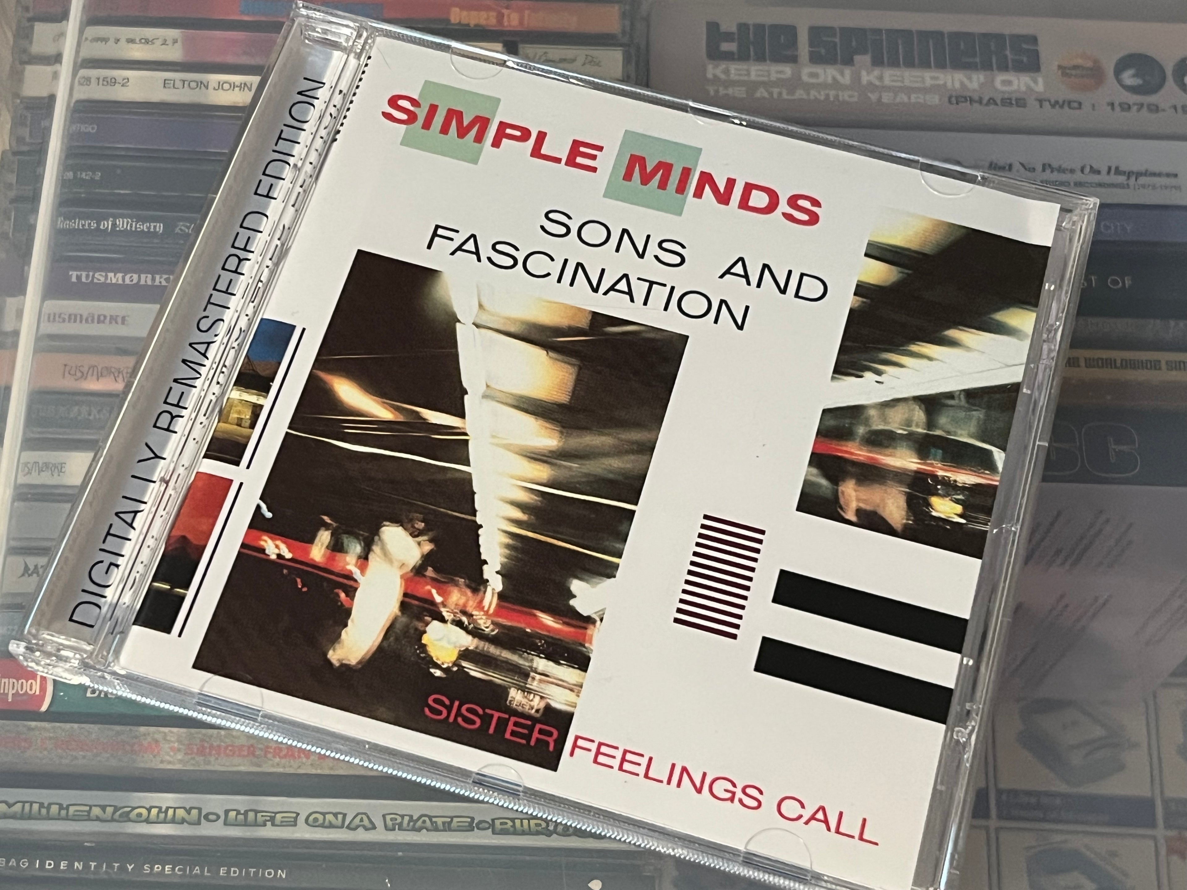 Simple Minds – Sons And Fascination / Sister Feelings Call (NM/NM)