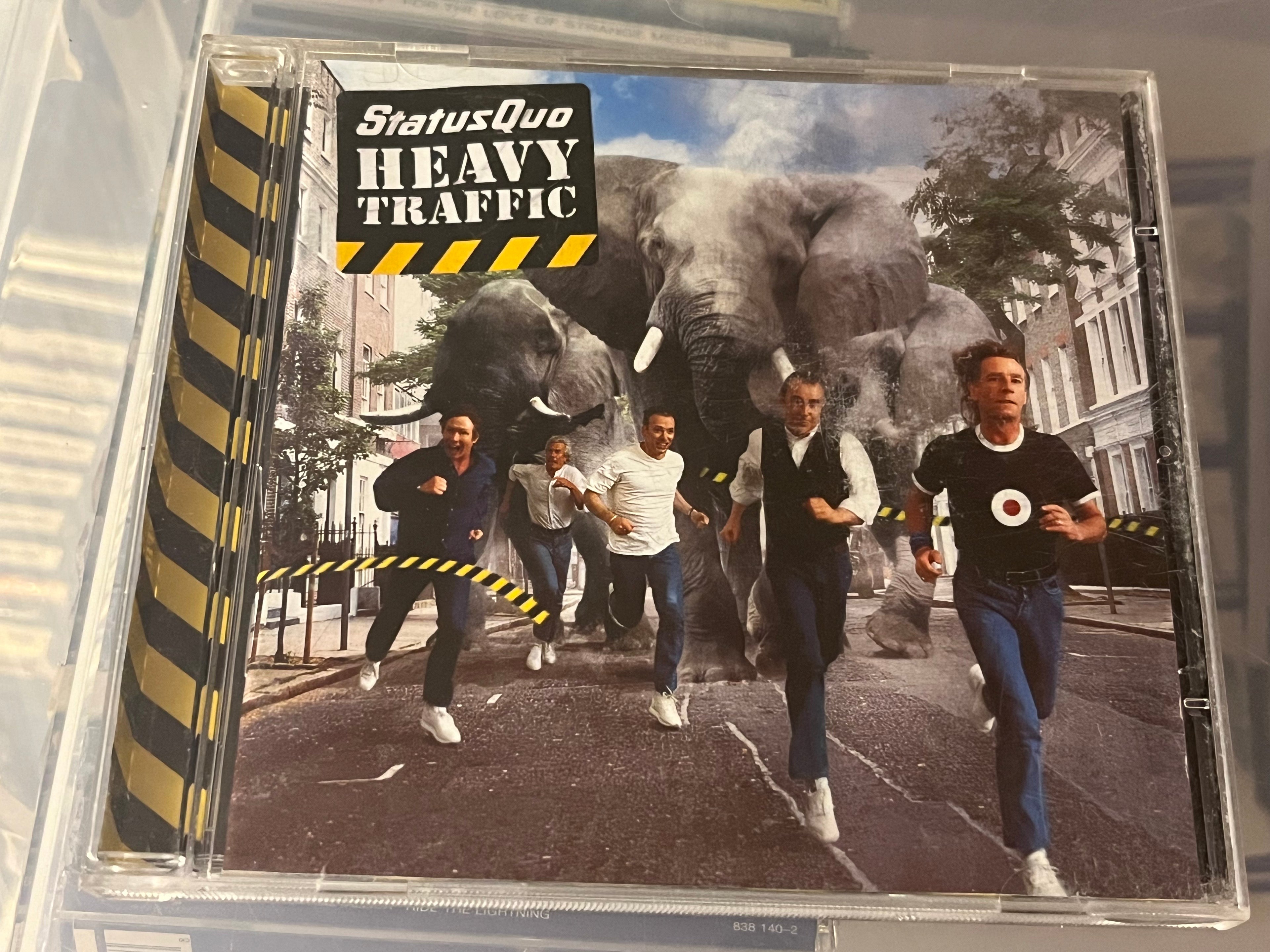 Status Quo - Heavy Traffic (vg+/vg) slitet booklet