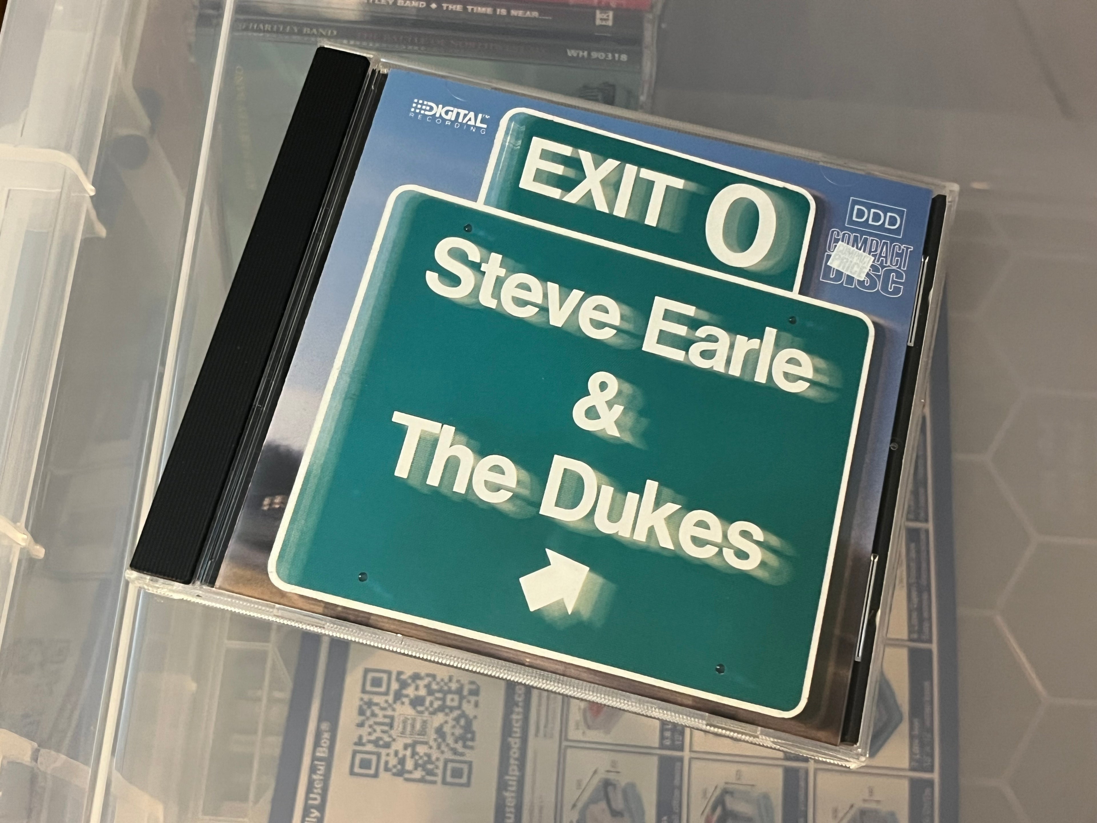 Steve Earle & The Dukes – Exit 0 (NM/NM)
