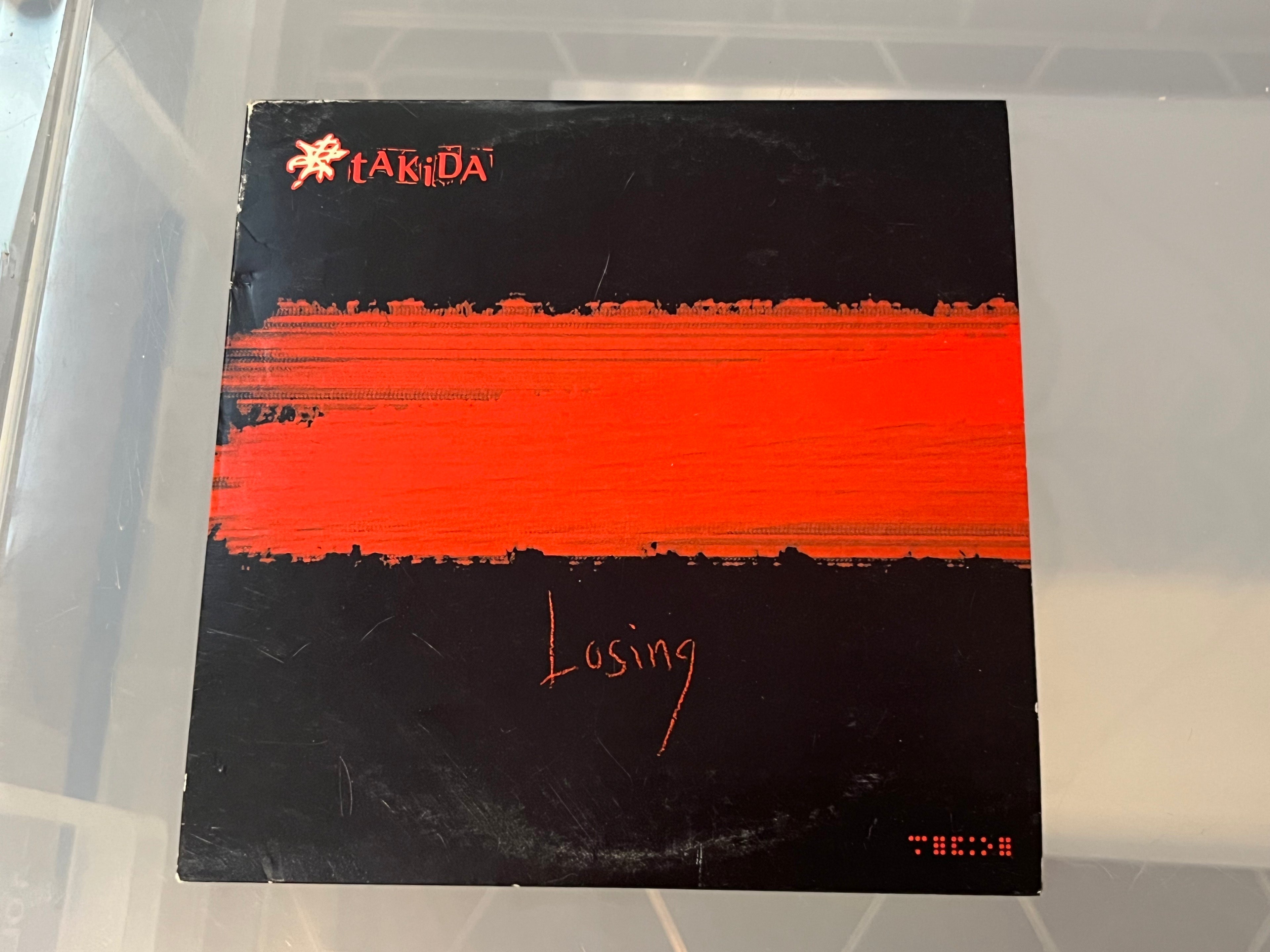 Takida – Losing (vg+/vg) 1-spårs single + 2 videospår i cardboard cover