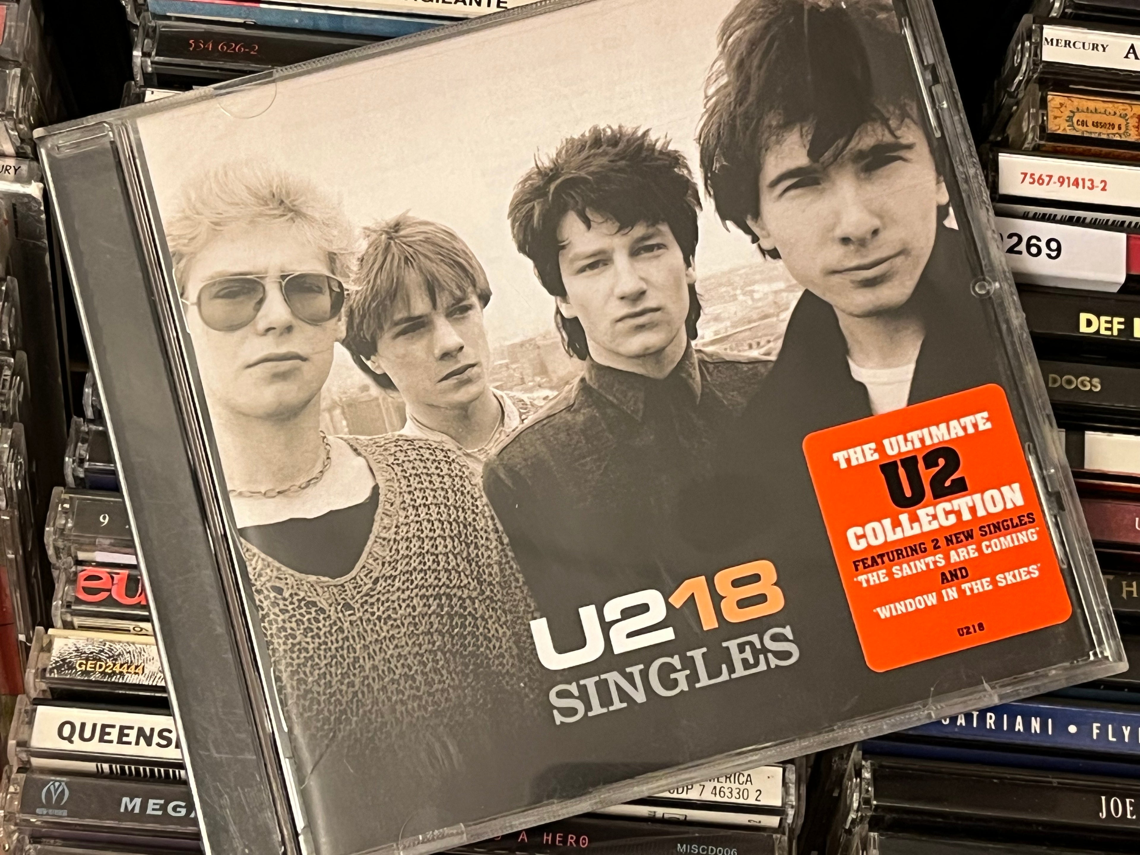 U2 – U218 Singles (NM/NM)